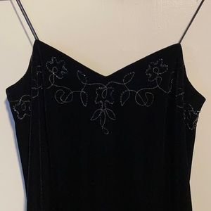 Betsy & Adam floor length black velvet gown with sheer back panels and beading